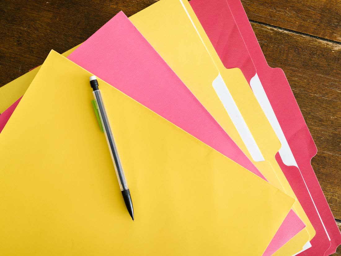 Colorful document folders on a desk