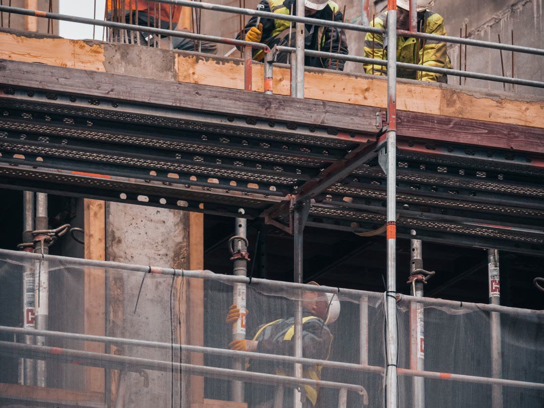 A worker on site checking their phone