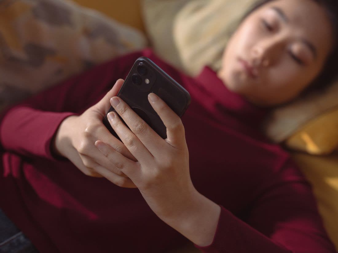 Someone speaking into their phone